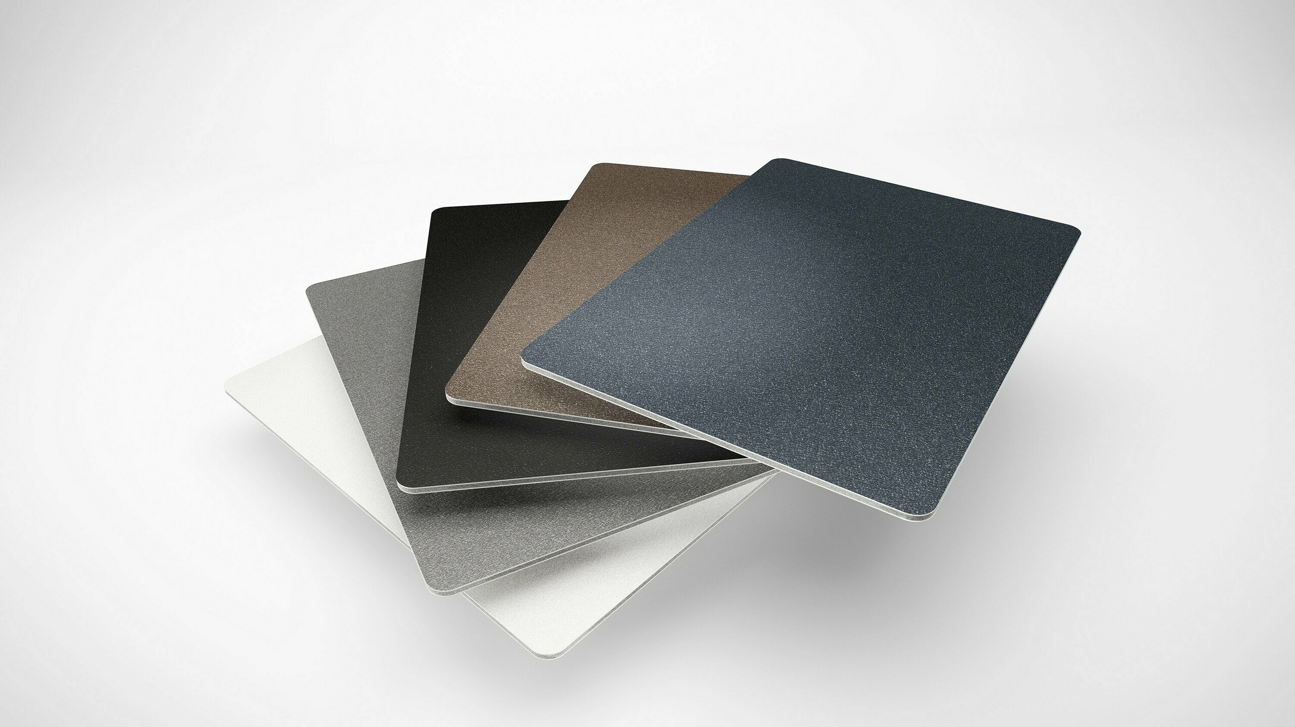 Die PREFABOND Aluminium Verbundplatten  gibt es jetzt in fünf neuen P.10 Farben.  Die einzelnen Farbmuster liegen wie ein  Fächer übereinander.