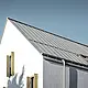 Dach dwuspadowy bez okapu, pokryty PREFALZ w kolorze P.10 szarocynkowy, z rynną leżącą PREFA